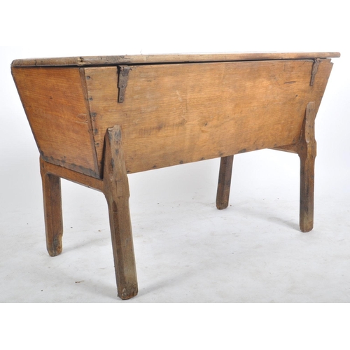 136 - A 19th century country French scrumbled pine dough bin on stand. The angled body complete with a hin... 