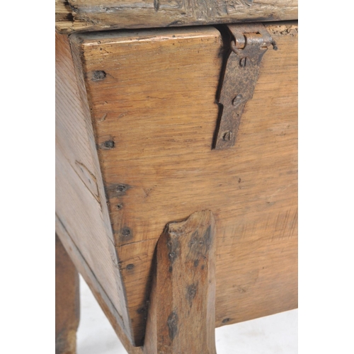 136 - A 19th century country French scrumbled pine dough bin on stand. The angled body complete with a hin... 