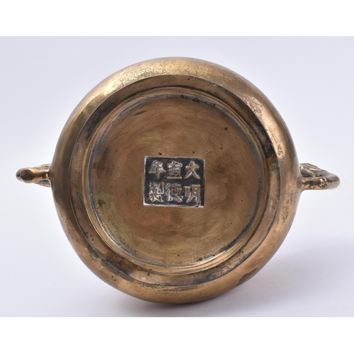 139 - A Xuande reign marked Chinese bronze censer with elephant head handles. The censer with six-characte... 