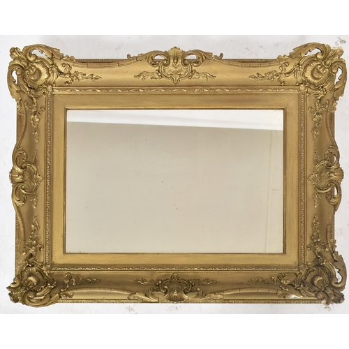 148 - A 19th century giltwood and gesso plaster framed hanging overmantel mirror. The plate mirror of rect... 