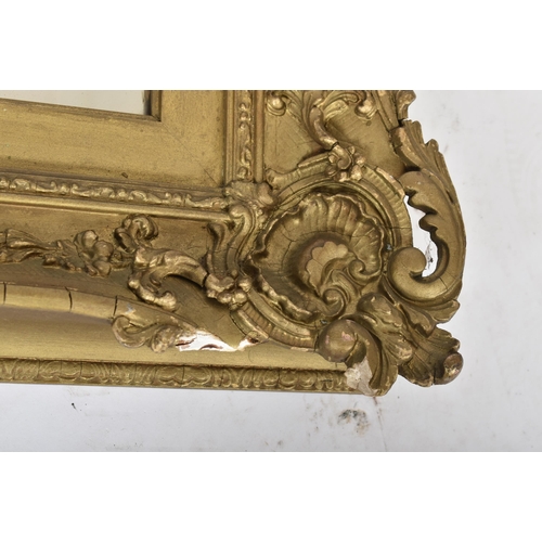 148 - A 19th century giltwood and gesso plaster framed hanging overmantel mirror. The plate mirror of rect... 