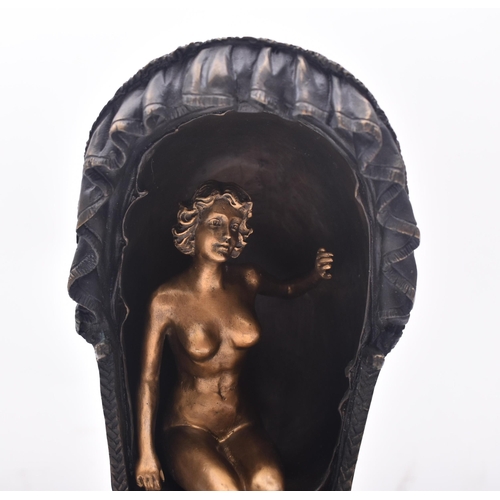 150 - An early 20th century circa 1930s Continental Austrian bronze of a gold figured nude woman seated in... 