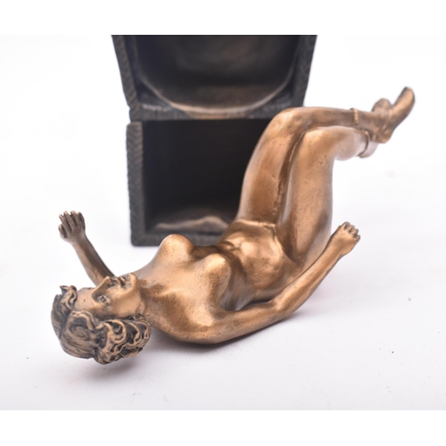 150 - An early 20th century circa 1930s Continental Austrian bronze of a gold figured nude woman seated in... 