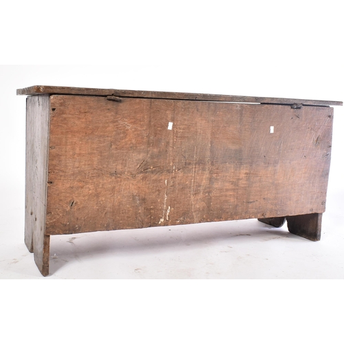 152 - A 17th century oak coffer chest of simple rectangular form. The coffer having a hinged top with cham... 