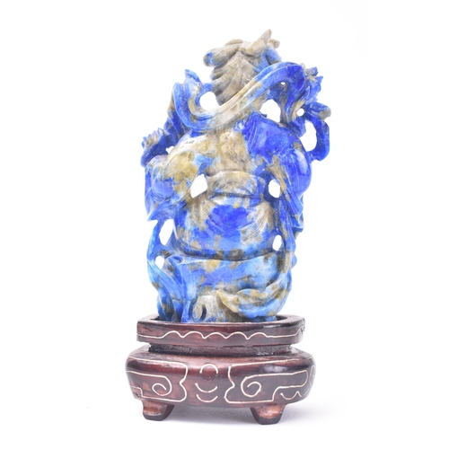 155 - A Chinese Lapis Lazuli carving of Guanyin. The figure of Guanyin hand-carved in China during the lat... 