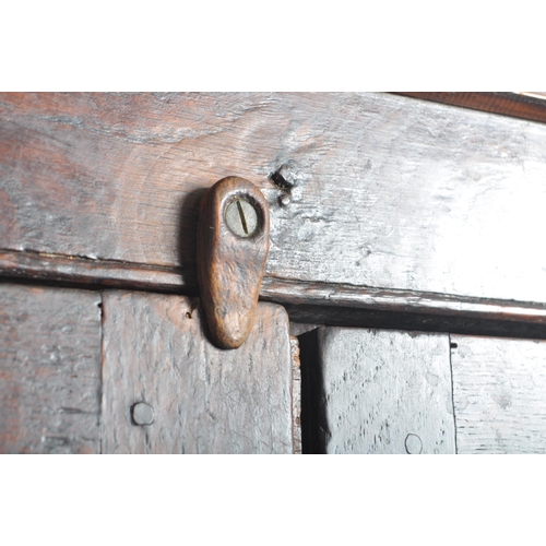 156 - An 18th century George III country oak housekeepers cupboard - press. Raised on bracket feet with fi... 