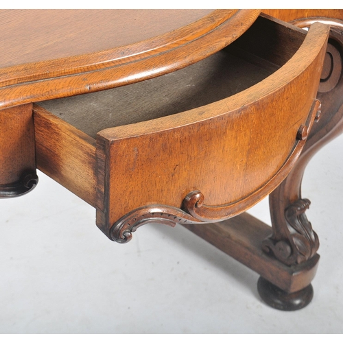 157 - A Victorian 19th century carved oak inverted serpentine front console hall table. The table having a... 