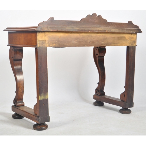 157 - A Victorian 19th century carved oak inverted serpentine front console hall table. The table having a... 