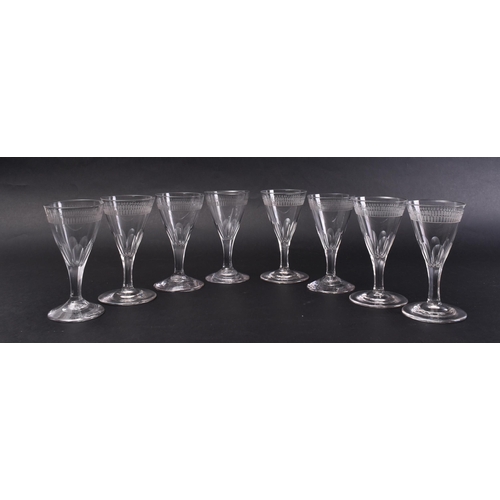 16 - A set of eight mid - late 18th century George III facet cut stem wine glasses. Each glass of taperin... 