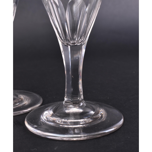 16 - A set of eight mid - late 18th century George III facet cut stem wine glasses. Each glass of taperin... 