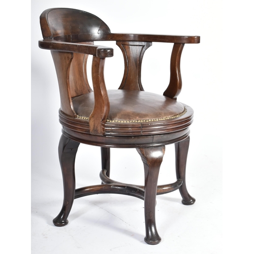 160 - A Victorian 19th century mahogany desk office swivel revolving chair. The chair having a shaped back... 