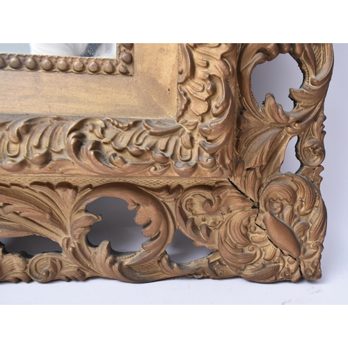 161 - A 19th century Rococo style gilt wood scroll leaf wall hanging mirror. The mirror having an intricat... 