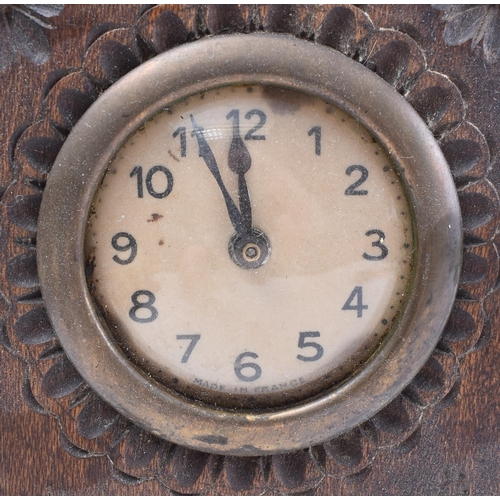 166 - A 19th century French Breton oak mantel clock. The provincial Breton oak case of upright form having... 