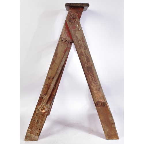 175 - An early to mid 20th century three-rung stepladder. Traditional form, with steel locking hooked supp... 