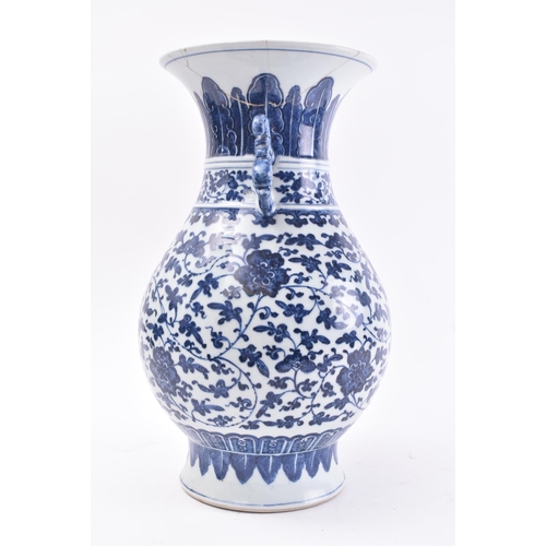 178 - A 19th century Chinese Qing Dynasty blue and white vase in the Ming taste. The vase having a flared ... 