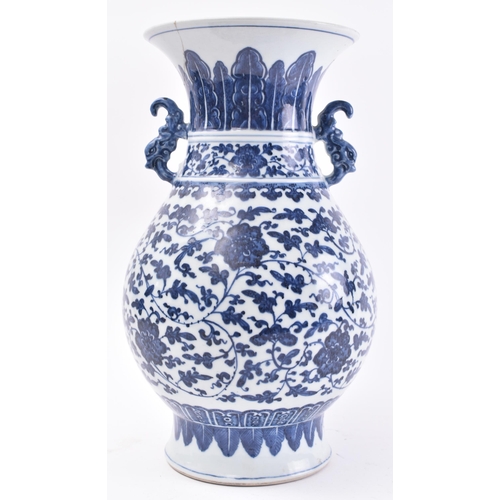 178 - A 19th century Chinese Qing Dynasty blue and white vase in the Ming taste. The vase having a flared ... 