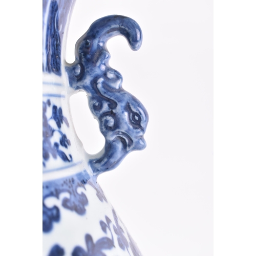 178 - A 19th century Chinese Qing Dynasty blue and white vase in the Ming taste. The vase having a flared ... 