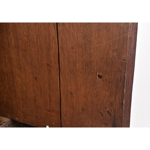 180 - A 17th century heavily carved oak Flemish cabinet on stand. The cabinet top having a flyaway cornice... 