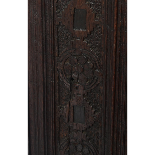 180 - A 17th century heavily carved oak Flemish cabinet on stand. The cabinet top having a flyaway cornice... 