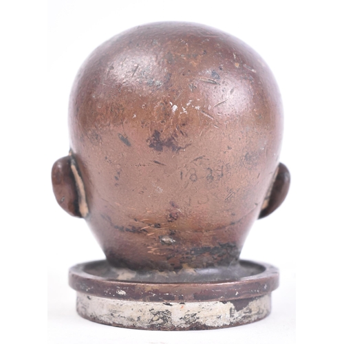 182 - An early 20th century circa 1920s bronze doll's head mould. Marked 183 to back. Measures approx. 9cm... 