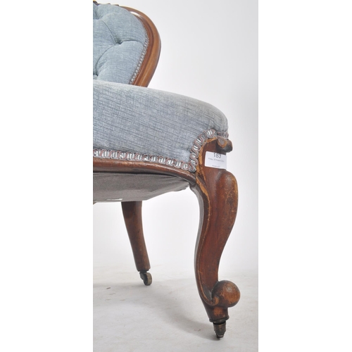 183 - A 19th century high Victorian mahogany spoon back ladies nursing chair / bedroom chair. The chair ha... 