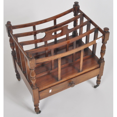 188 - A Victorian 19th century carved walnut Canterbury magazine rack. The rack having top central handle ... 