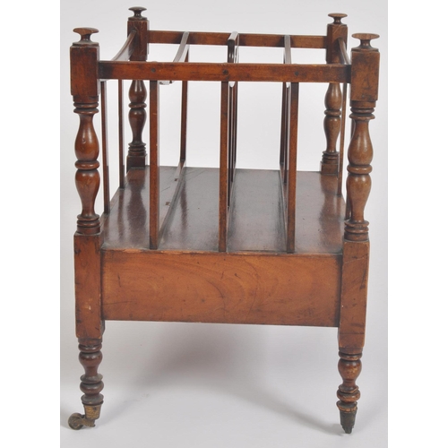 188 - A Victorian 19th century carved walnut Canterbury magazine rack. The rack having top central handle ... 