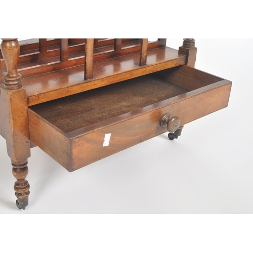 188 - A Victorian 19th century carved walnut Canterbury magazine rack. The rack having top central handle ... 