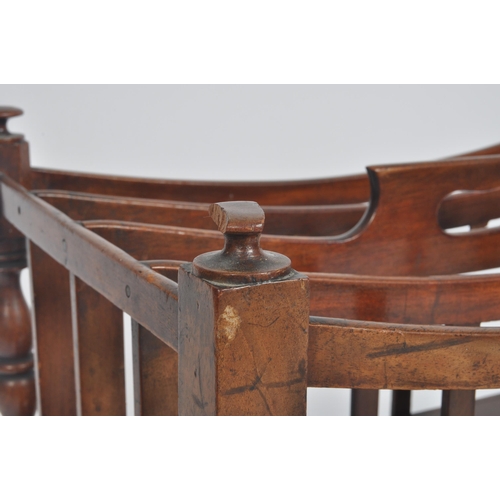 188 - A Victorian 19th century carved walnut Canterbury magazine rack. The rack having top central handle ... 