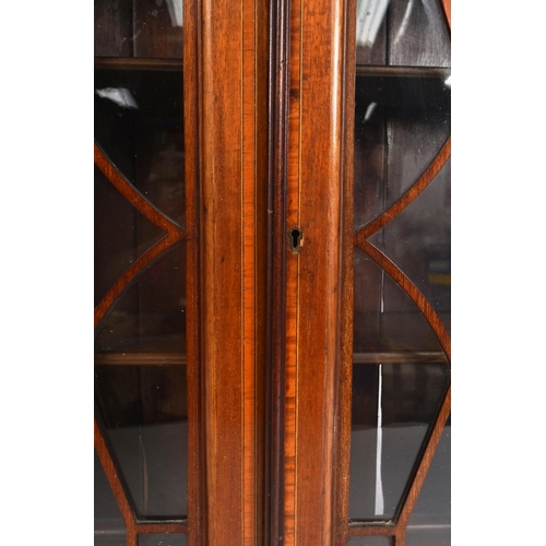 189 - An Edwardian mahogany and boxwood inlaid astragal glazed wall hanging display cabinet. Twin astragal... 