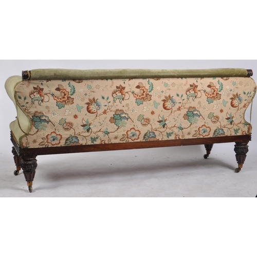 194 - A William IV 19th century mahogany framed three seater settee in green upholstery. The sofa having a... 