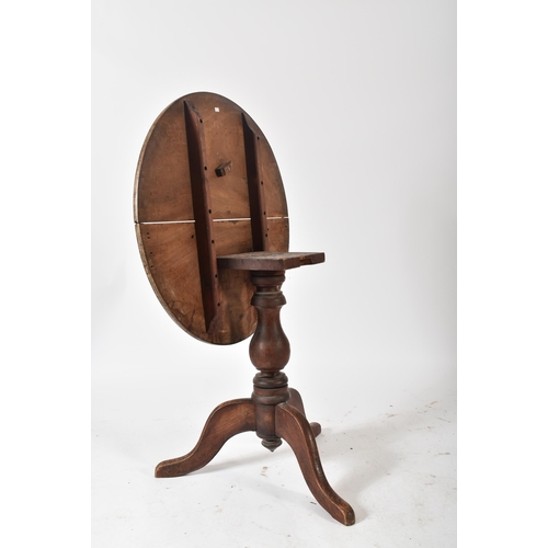 198 - An 18th century George III mahogany tilt top pedestal table. The table having a mahogany circular to... 