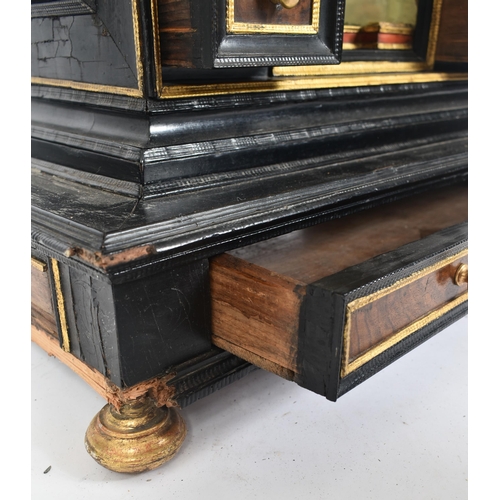 200 - A 17th century German table top cabinet chest. The cabinet in ebonised and walnut wood with gilt det... 