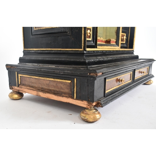 200 - A 17th century German table top cabinet chest. The cabinet in ebonised and walnut wood with gilt det... 