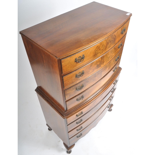 201 - A Queen Anne revival bow fronted mahogany chest on chest of drawers / tallboy. The tallboy being rai... 