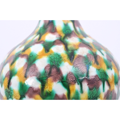 202 - An early 20th century Chinese Qing Dynasty San-Cai porcelain tri-colour vase. The vase having an elo... 