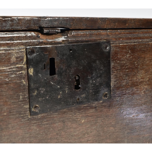 203 - A 17th century oak coffer chest of simple rectangular form. The coffer having a hinged top with cham... 