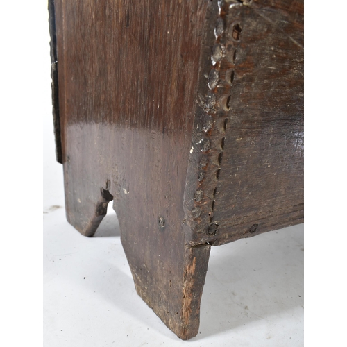 203 - A 17th century oak coffer chest of simple rectangular form. The coffer having a hinged top with cham... 