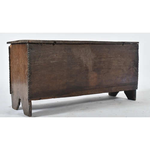 203 - A 17th century oak coffer chest of simple rectangular form. The coffer having a hinged top with cham... 