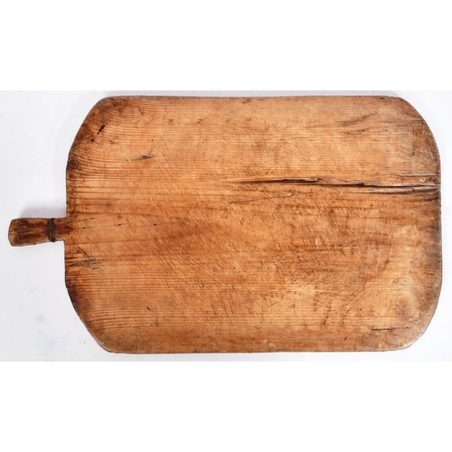 205 - A 19th century believed Turkish pine bread / cheese board. Country / rustic form, with a wire twist ... 