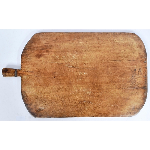 205 - A 19th century believed Turkish pine bread / cheese board. Country / rustic form, with a wire twist ... 