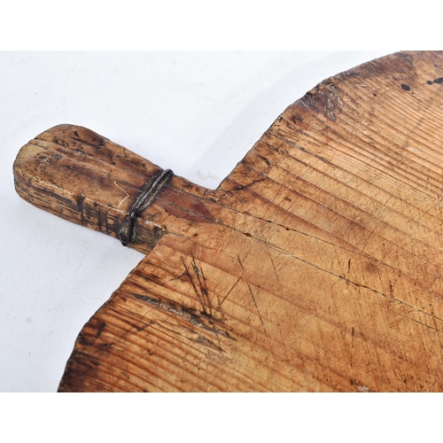 205 - A 19th century believed Turkish pine bread / cheese board. Country / rustic form, with a wire twist ... 