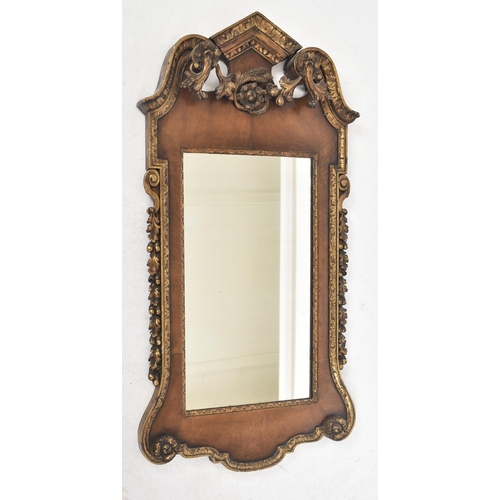 206 - A George II 18th century walnut & parcel gilt wall hanging mirror. The mirror having a pair of scrol... 