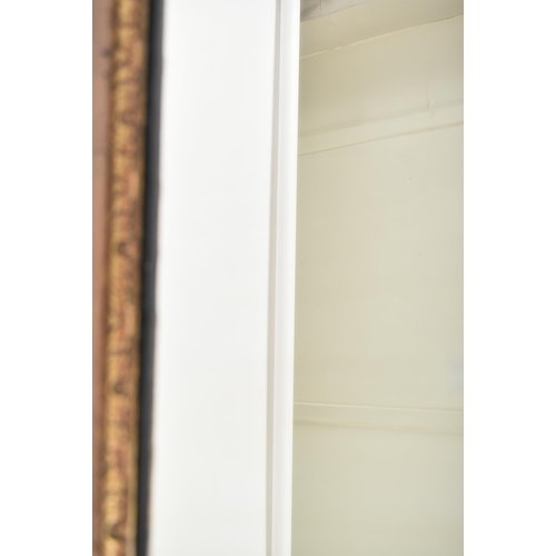 206 - A George II 18th century walnut & parcel gilt wall hanging mirror. The mirror having a pair of scrol... 