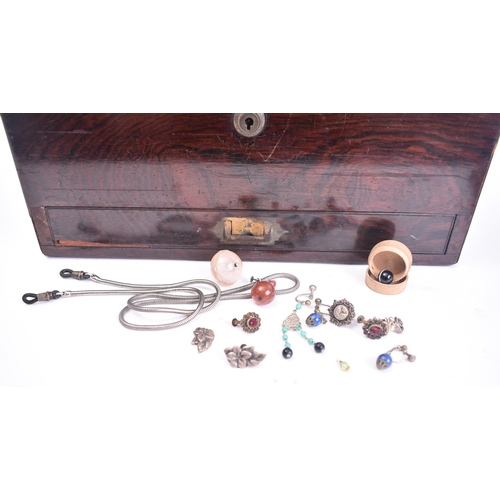 211 - A 19th century rosewood ladies travelling vanity case. The rosewood box with central oval brass mono... 