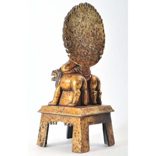 213 - A 19th century Chinese Qing Dynasty gilt bronze Buddha. Buddha being seated upon a throne chair with... 