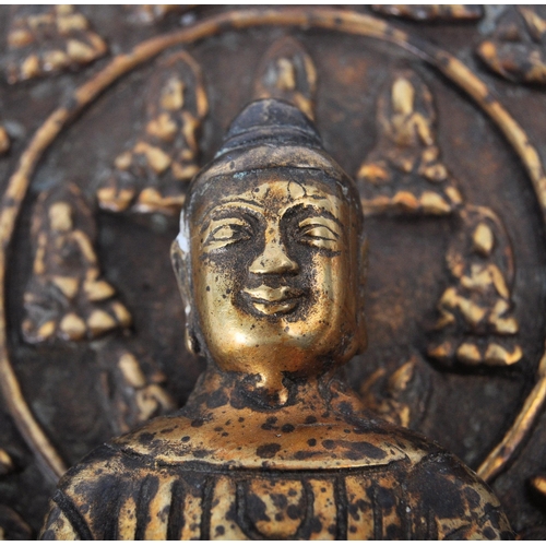 213 - A 19th century Chinese Qing Dynasty gilt bronze Buddha. Buddha being seated upon a throne chair with... 