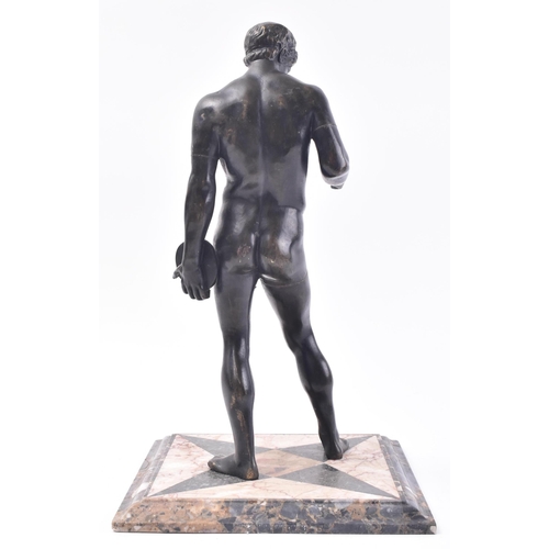 223 - A 19th century Grand Tour bronze sculpture in the form of a Greek discus thrower. The figure shown s... 