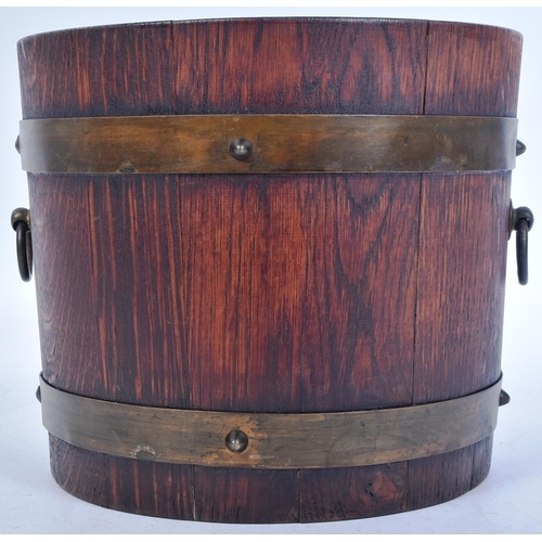 235 - An early 20th century Lister of Dursley made coopered oak barrel planter. Traditionally made, with b... 