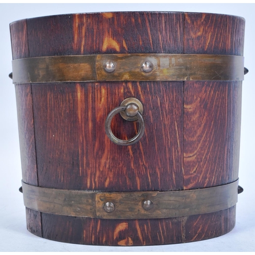 235 - An early 20th century Lister of Dursley made coopered oak barrel planter. Traditionally made, with b... 